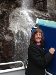Karen enjoying the falls. We got to drink from the waterfall too!