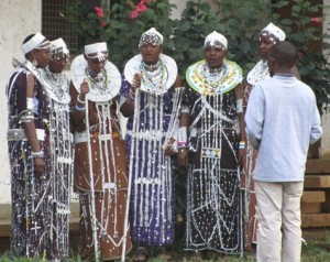 Pastor Nangole's gift to me is the cloth pieces under the collars and long dangling beads. These are MGLSS girls at a graduation, which affirms the indigenous culture!