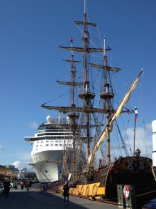 The juxtaposition of a 3 masted frigate replica from the late 1700s and a humongous cruise ship in the harbor caught my attention.