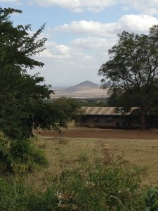 Almost back to MGLSS with a view of the small mountain, Lashine, over Mlimani Primary School
