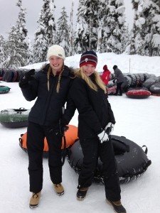 Annaliese and Anya tubing on the snow in Snoqualmie Pass with the church youth group
