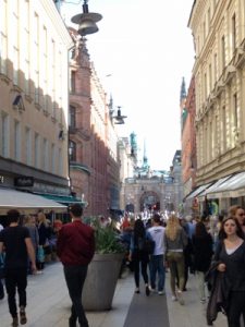 There are many people out shopping on a Saturday afternoon.