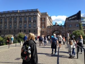 Walking on the bridge over to Gamla Stan, with the Royal Palace ahead to the left.