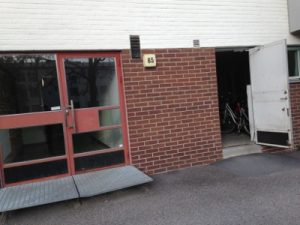 The front entrance and to the right is the bicycle storage