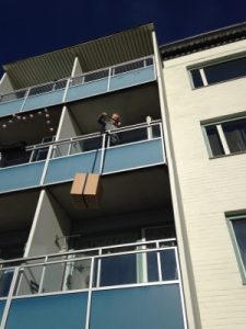 Lowering boxes was easier than climbing two flights of stairs.