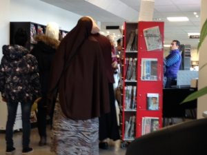 Refugees getting an orientation at the library. God bless their transition.