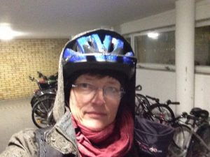 Parking my bike in the bicycle room after arriving at the apartment complex