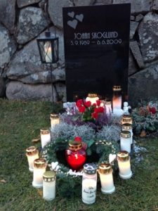 A well loved grave. Most graves had one to three candles.
