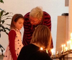 Donna has a special way with kids and youth. She helped with a candle lighting.